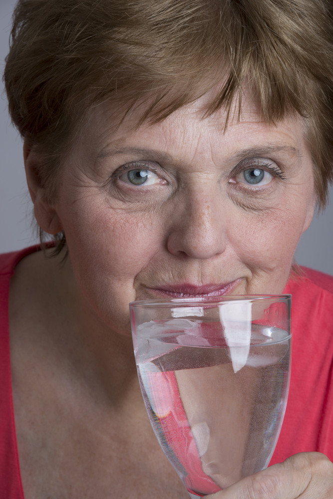 older woman drinking water.jpg